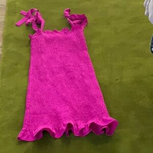 Mini dress in bright pink. Adjustable tie straps